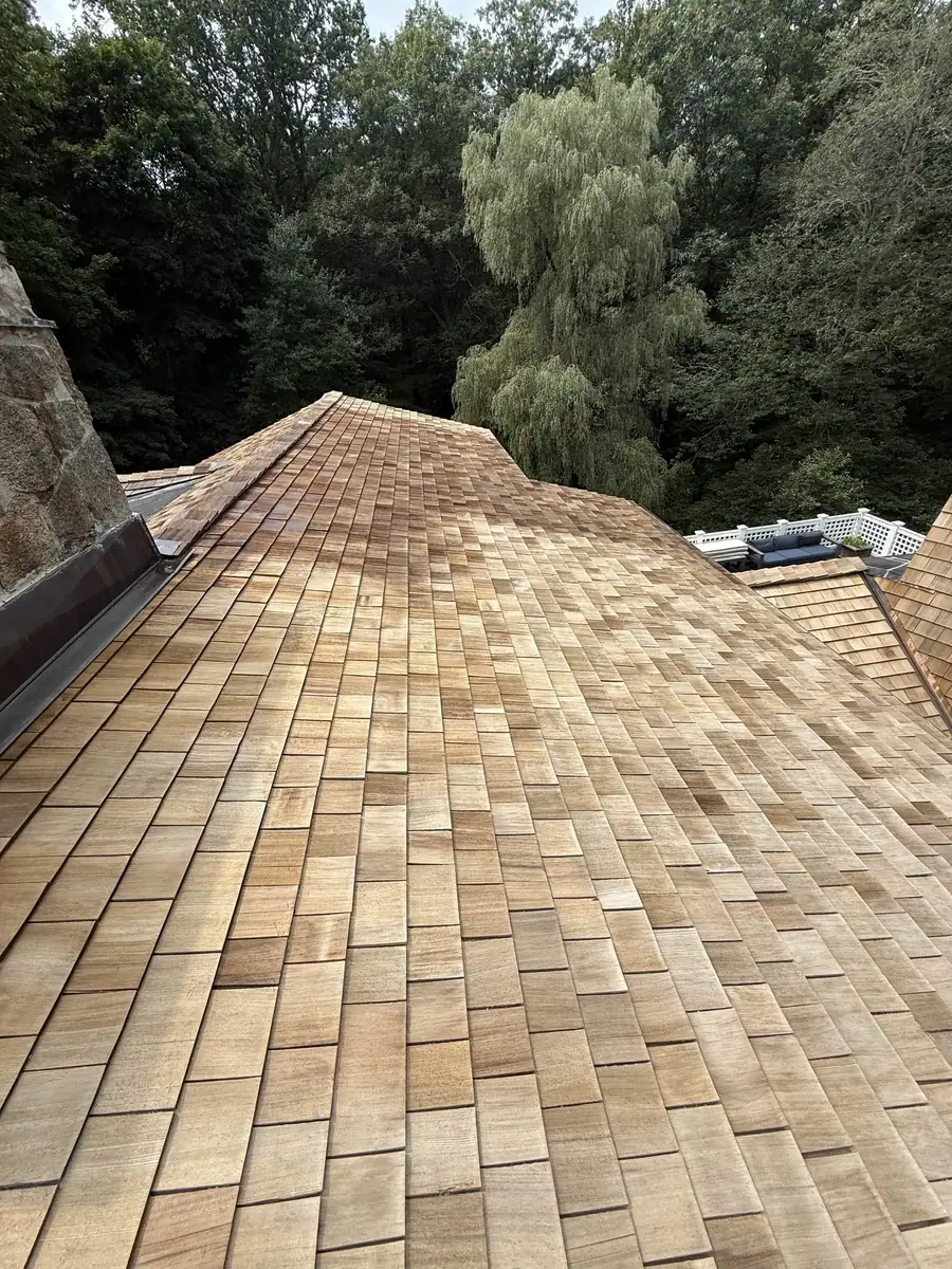 Cedar shake roof after clear natural sealer application