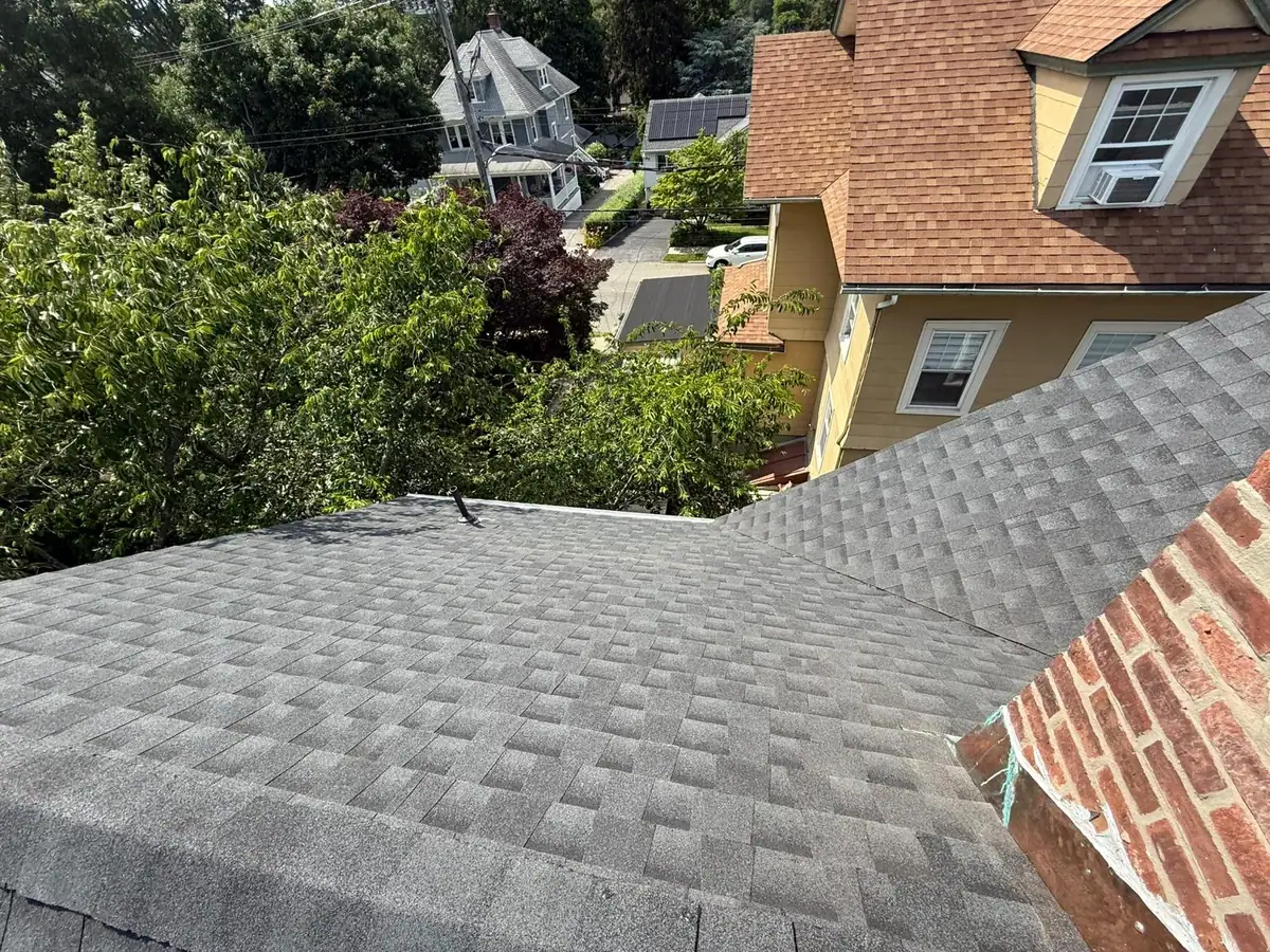 Completed roof slope and chimney transition in Mamaroneck