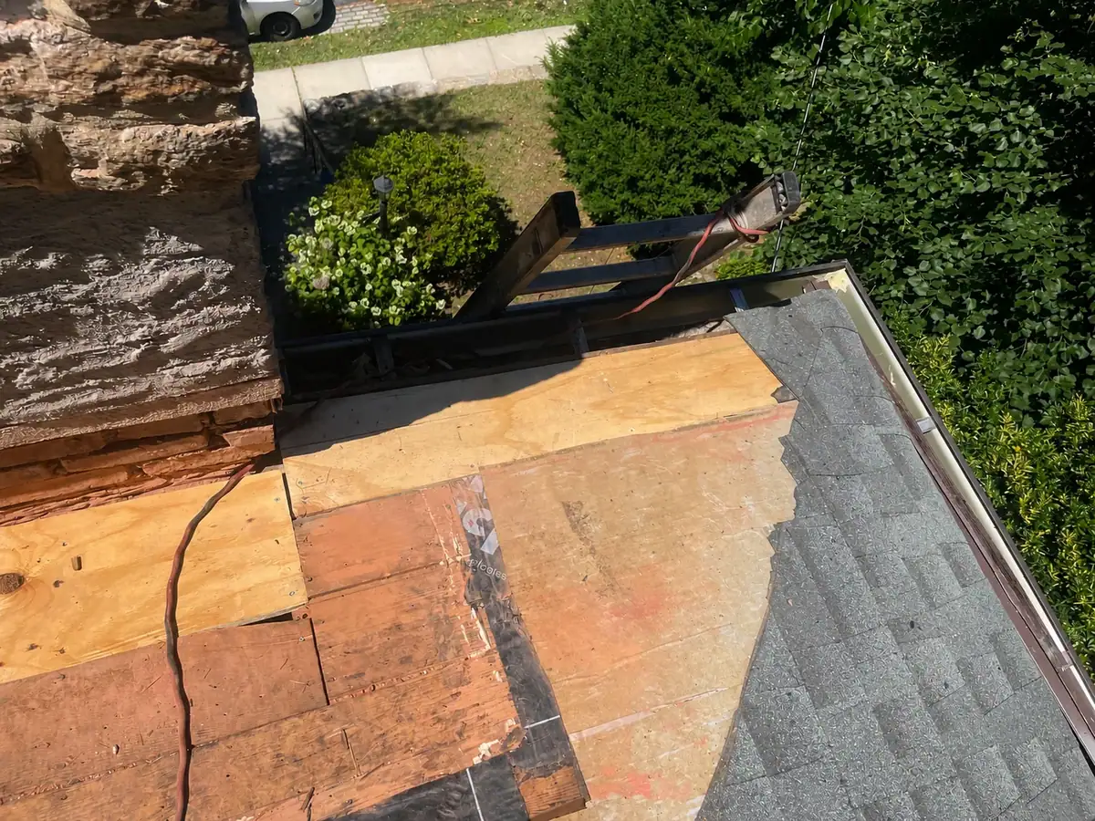 Completed roof decking preparation beside the chimney