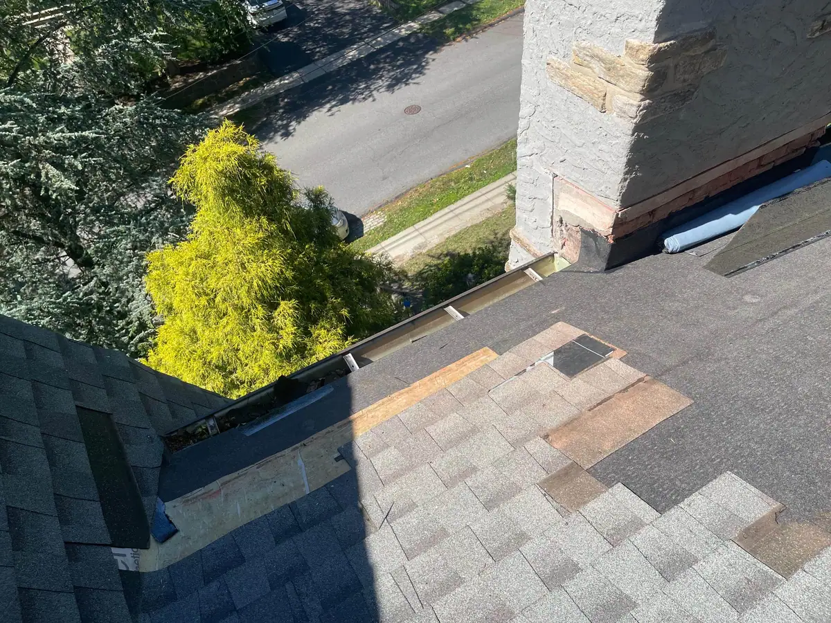 Roof preparation around the chimney before copper installation
