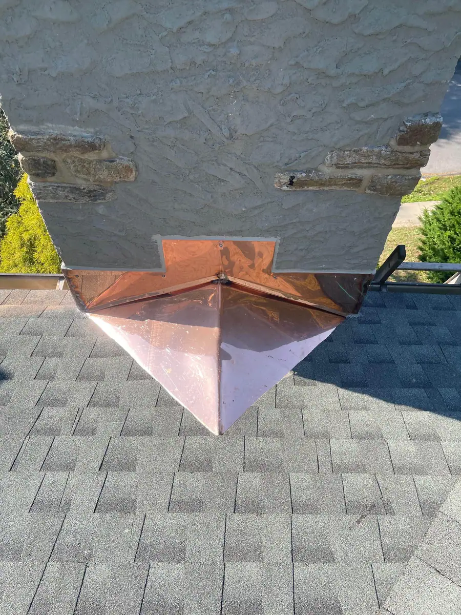 Front view of the finished custom copper chimney cricket