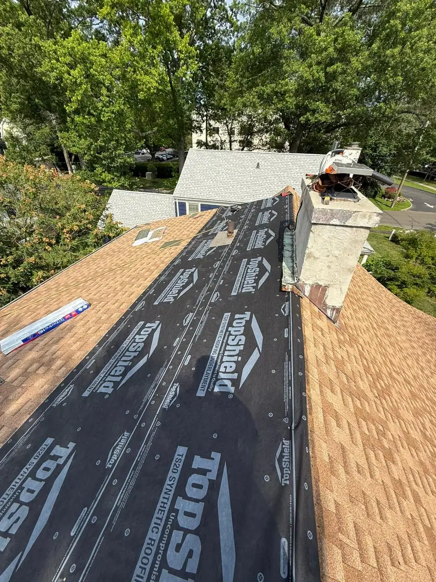 Waterproofing system installed at the chimney before new shingles